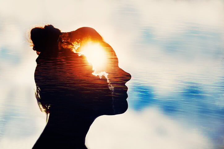 Silhouette of young woman on sky background with sun in her head. Silhouette of young woman on sky background with sun in her head.