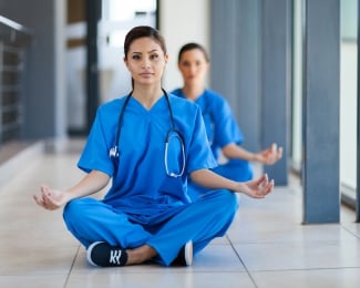 Two nurses meditating