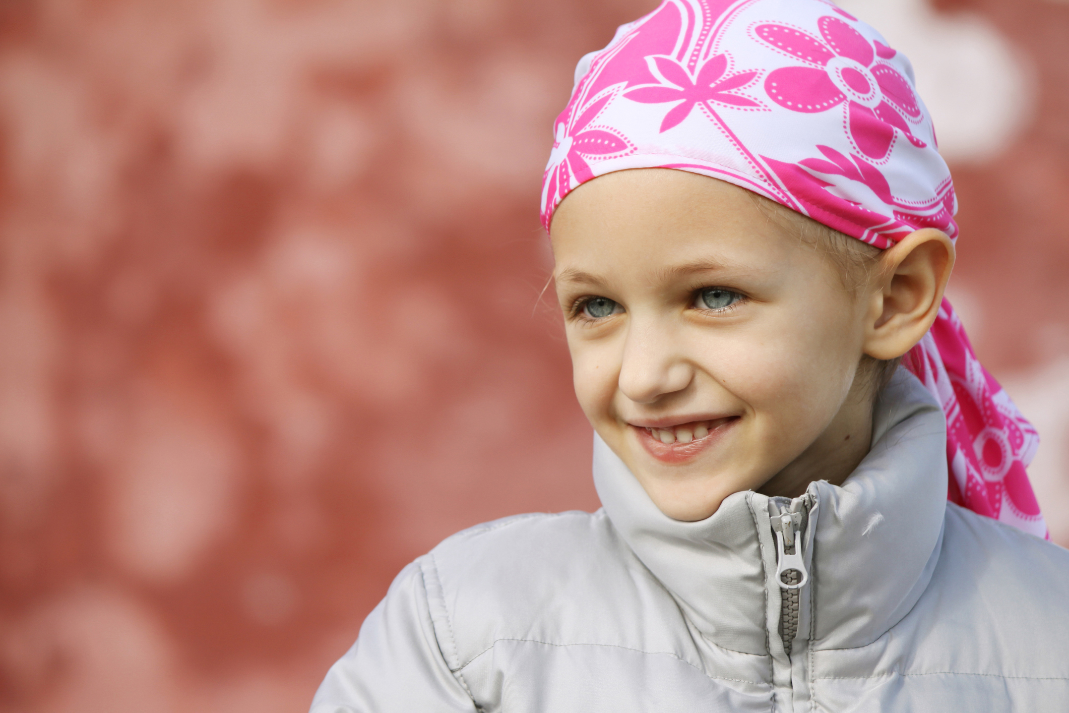 Little girl with scarf on her head smiling Little girl with scarf on her head smiling