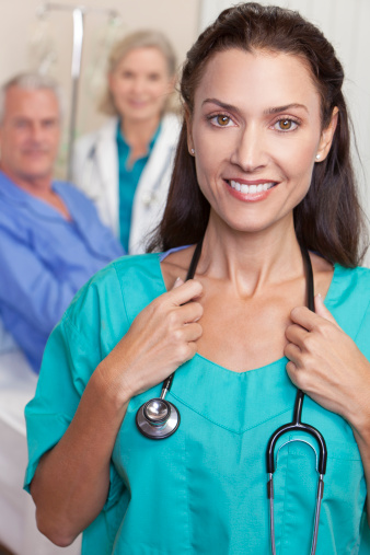 Nurse smiling with a stethoscope around her neck Nurse smiling with a stethoscope around her neck