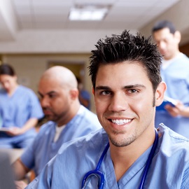 Male nurse smiling at the camera