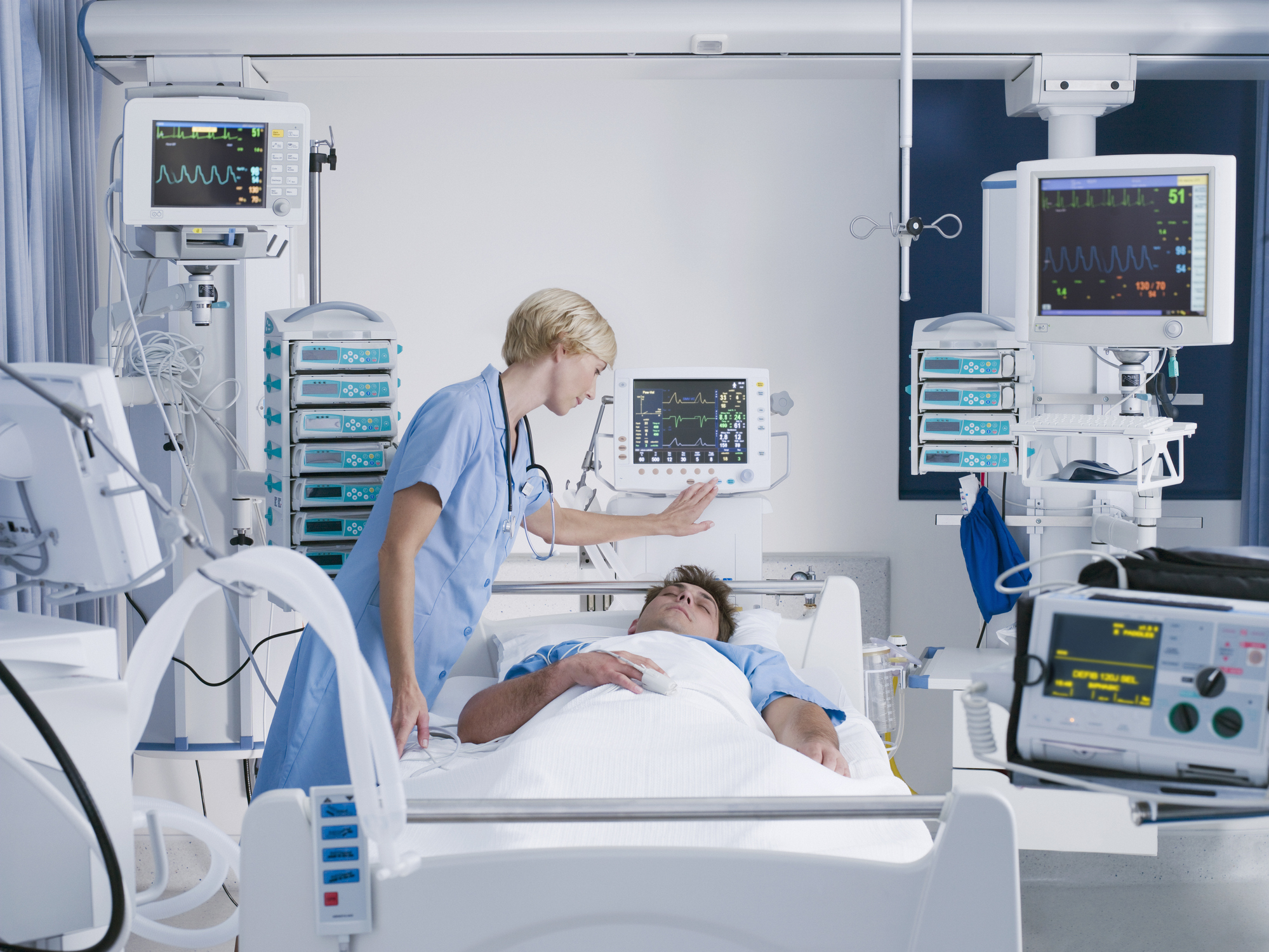 Nurse monitoring a patient Nurse monitoring a patient
