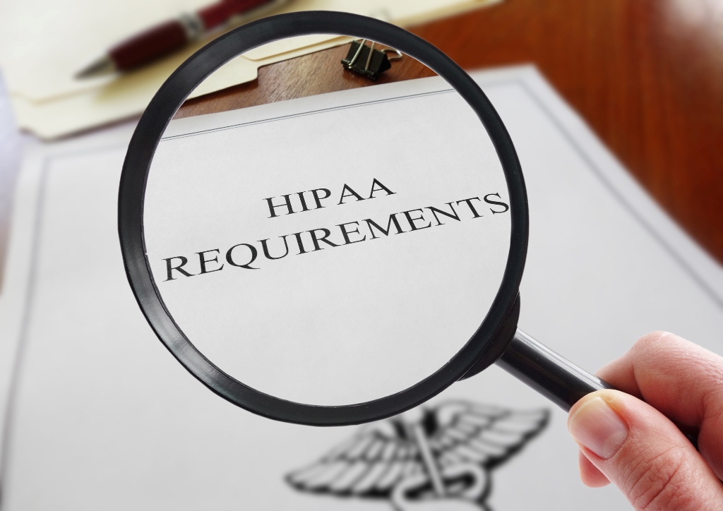 Magnifying glass over the words HIPAA requirements Magnifying glass over the words HIPAA requirements