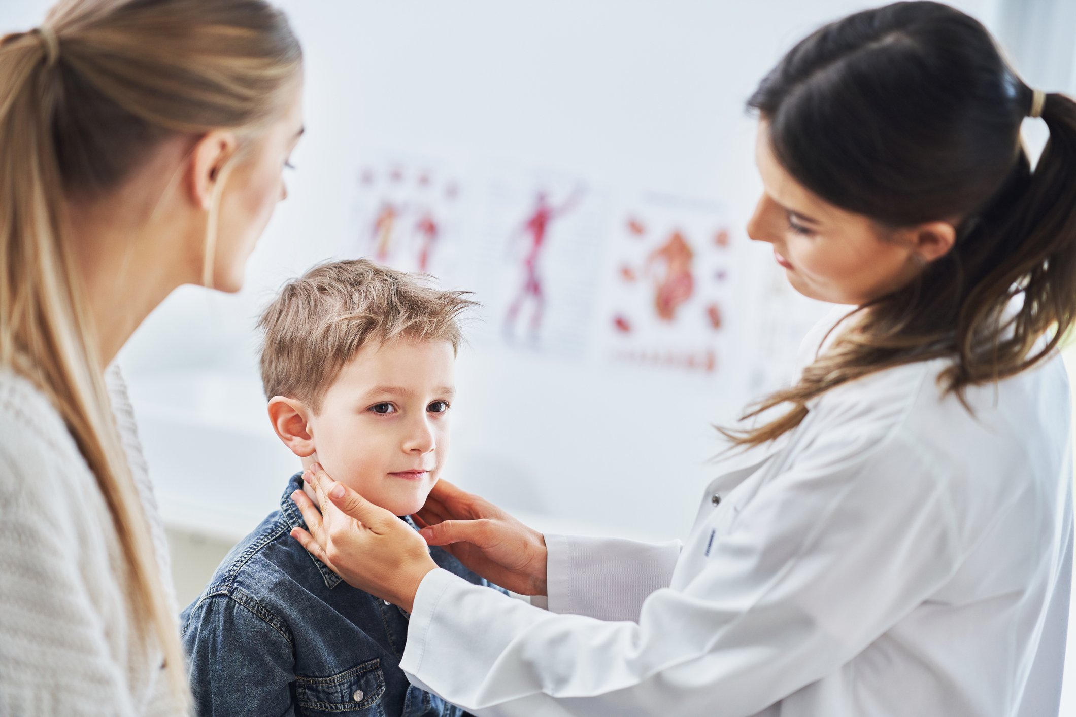 Doctor feeling child's lymph nodes Doctor feeling child's lymph nodes