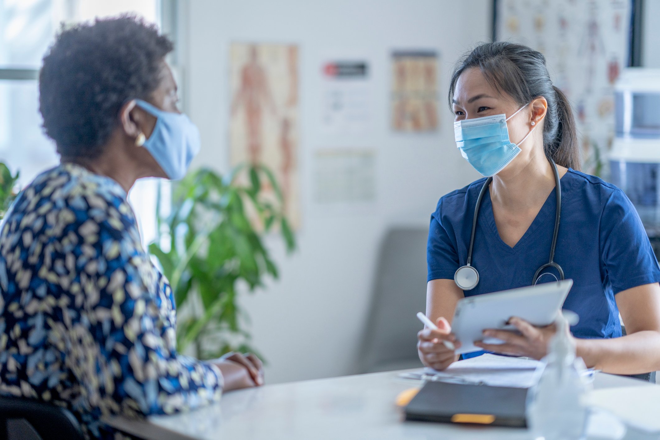 Nurse and patient talking with mask on Nurse and patient talking with mask on