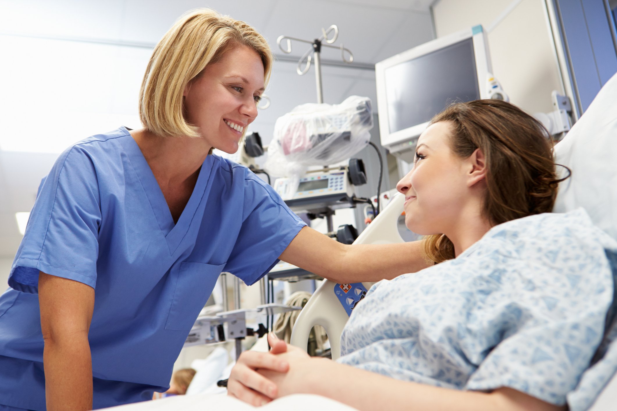 Nurse communicating with a patient Nurse communicating with a patient