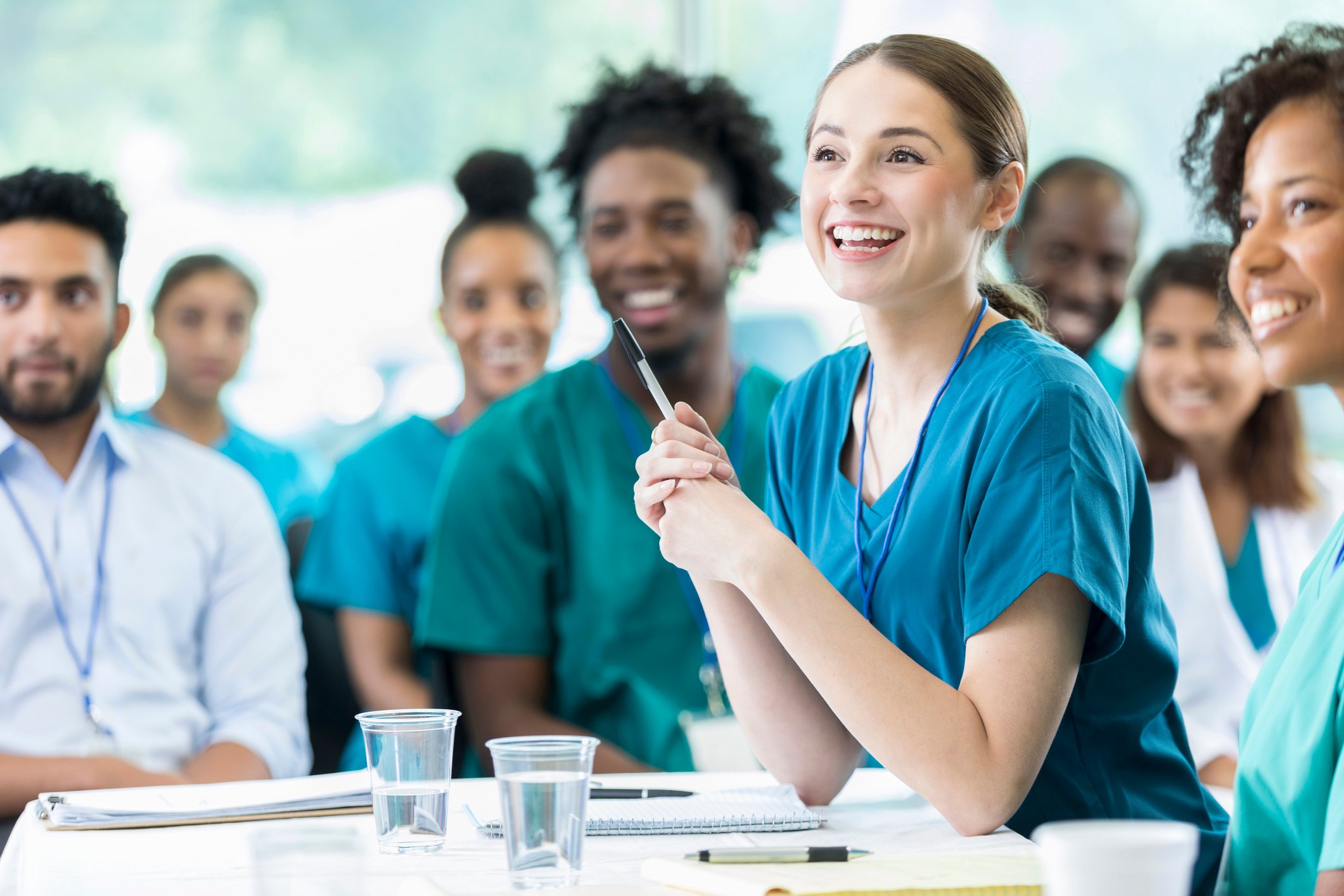 Nurses smiling in a board meeting Nurses smiling in a board meeting