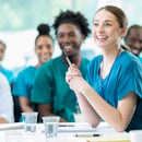 Nurses smiling in a board meeting Nurses smiling in a board meeting