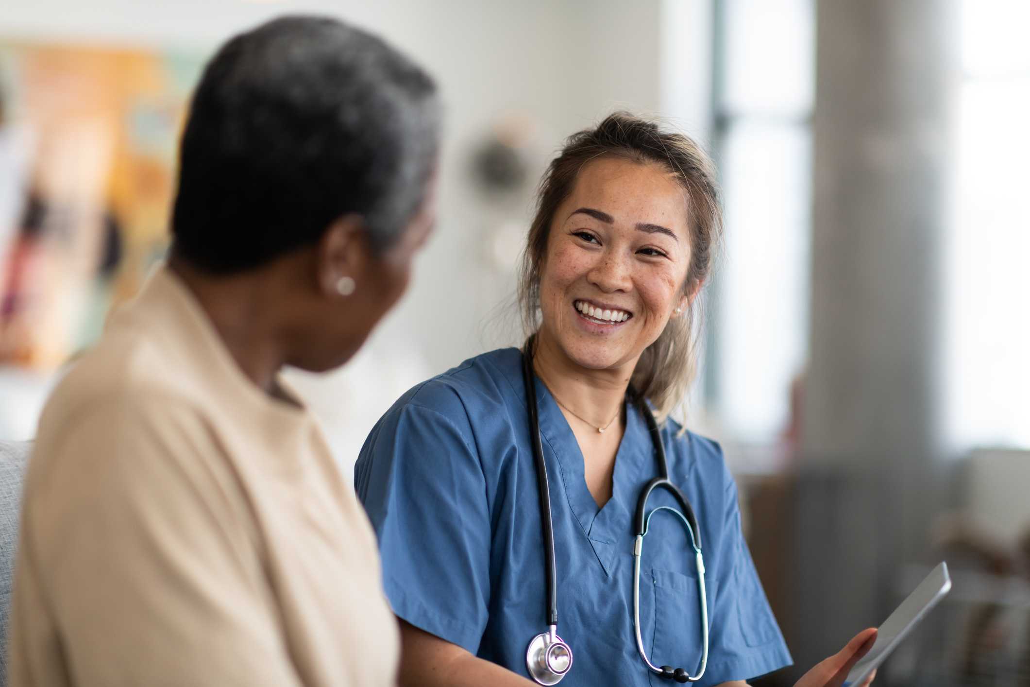 Nurse having dialogue with a patient Nurse having dialogue with a patient