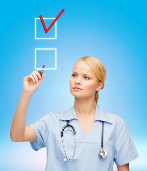 Nurse checking off boxes Nurse checking off boxes