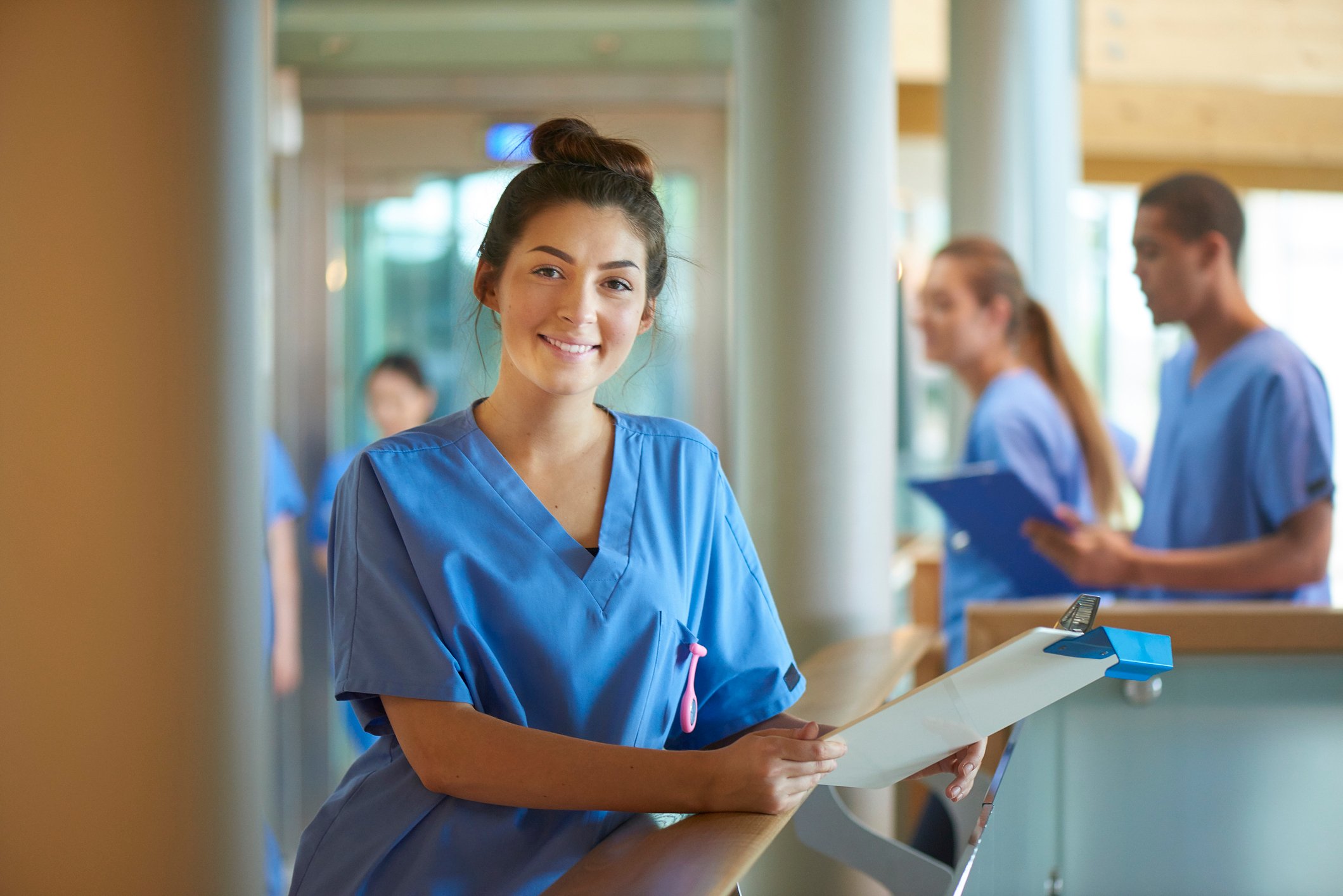 happy nurse smiling at station happy nurse smiling at station
