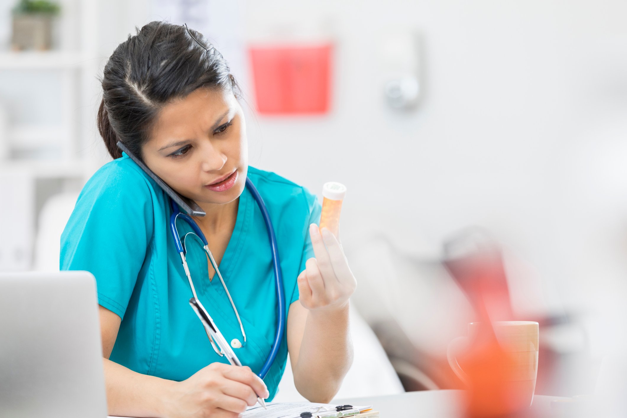 nurse on phone allocating medication nurse on phone allocating medication