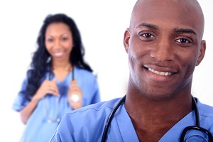 smiling man and woman in blue srubs smiling man and woman in blue srubs
