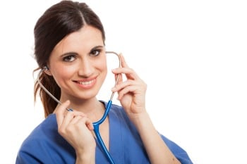 nurse in blue scrubs smiles big nurse in blue scrubs smiles big