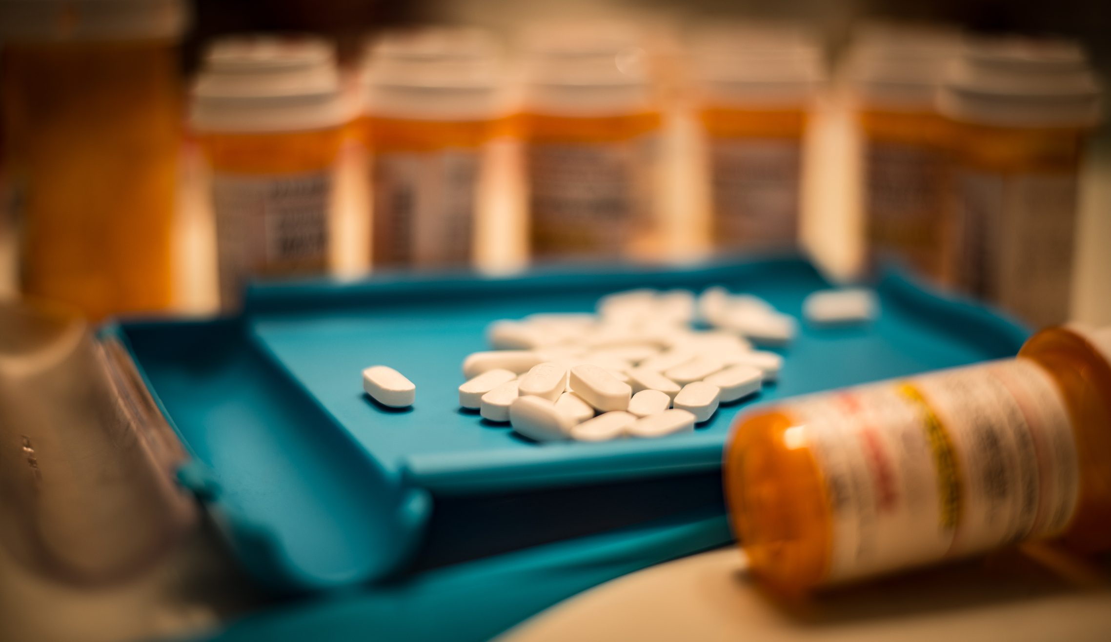 Opioid pills and prescription bottles Opioid pills and prescription bottles