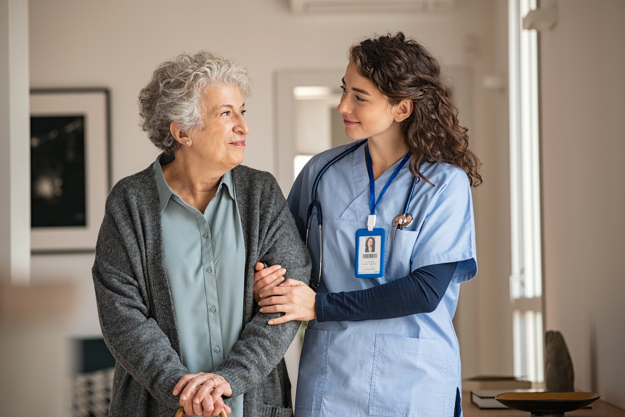 Nurse walking and talking with a patient