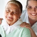 Health care professional and patient smiling Health care professional and patient smiling