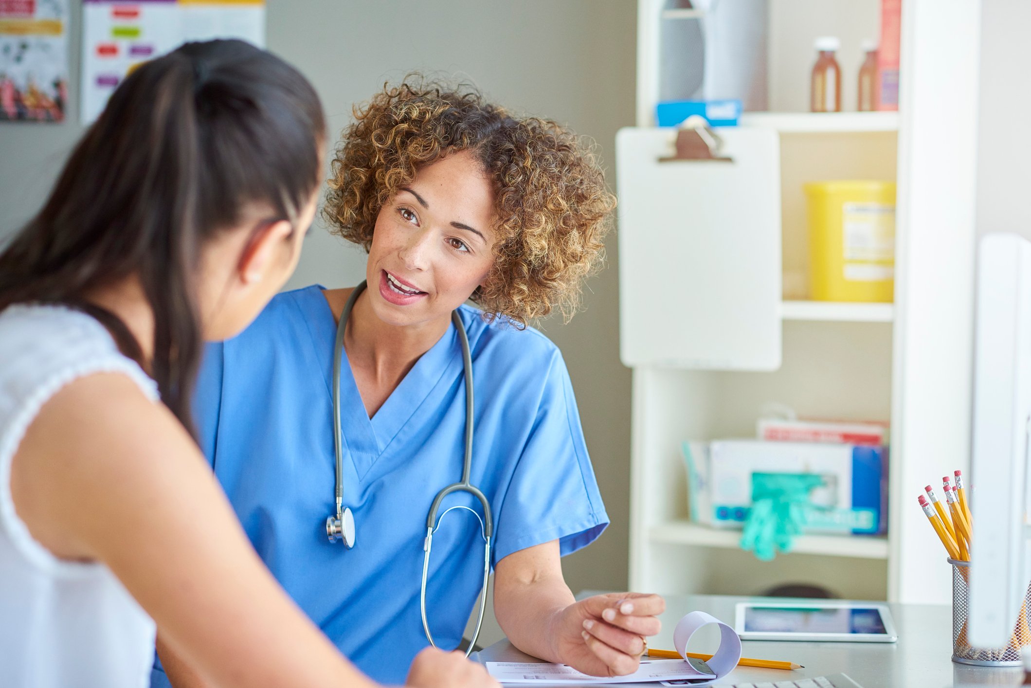 Nurse talking to a patient Nurse talking to a patient