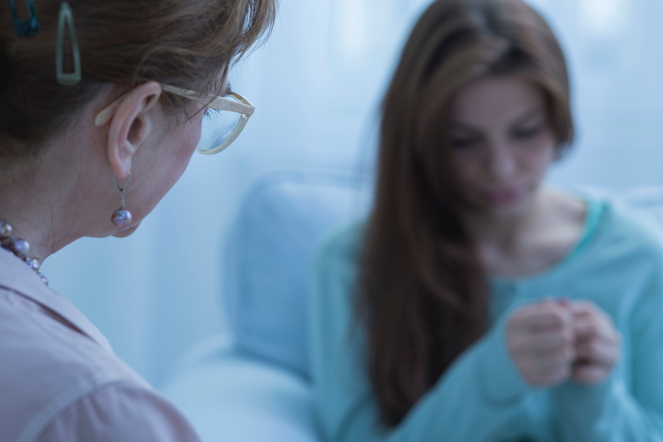 Nurse talking to a patient struggling with mental health Nurse talking to a patient struggling with mental health