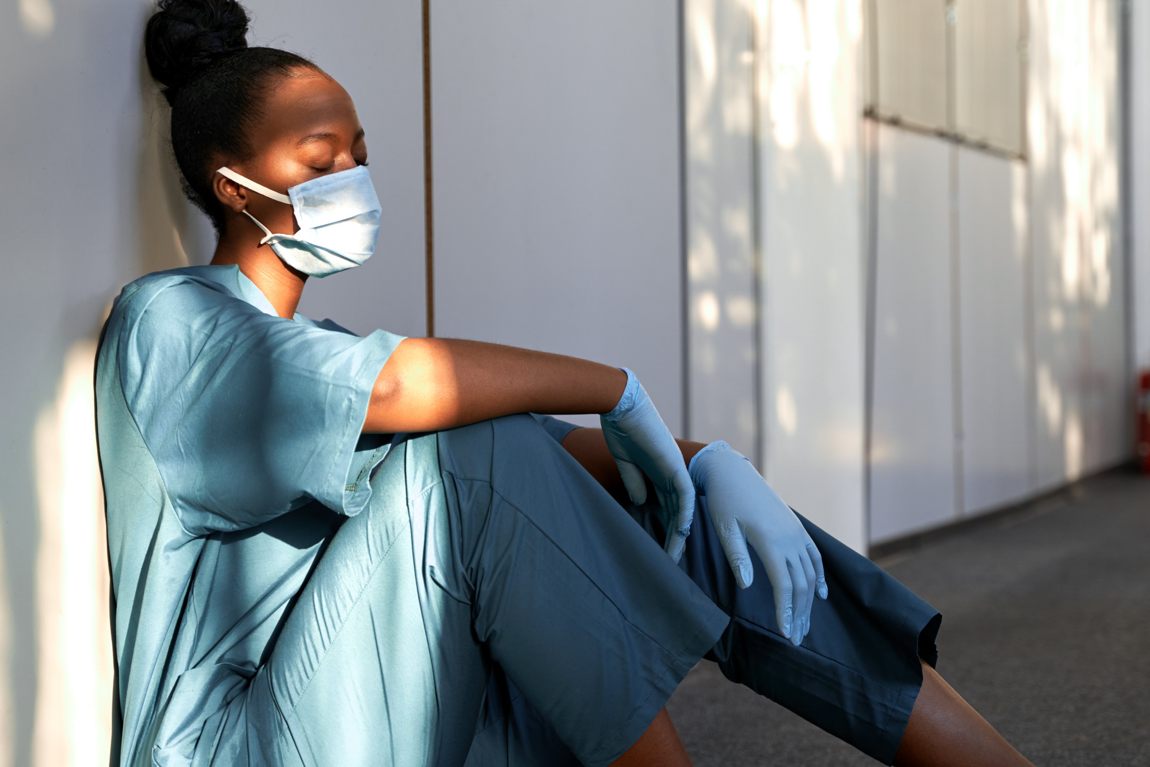 Stressed nurse in a mask and gloves Stressed nurse in a mask and gloves