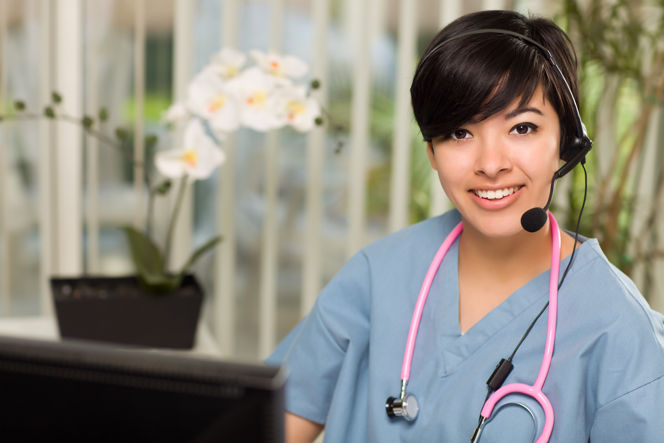 Nurse taking a Telehealth call Nurse taking a Telehealth call