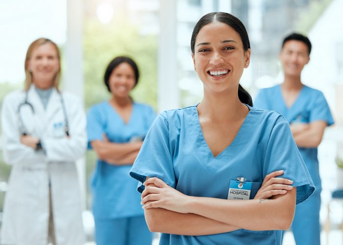 group of nurses smiling at the camera group of nurses smiling at the camera