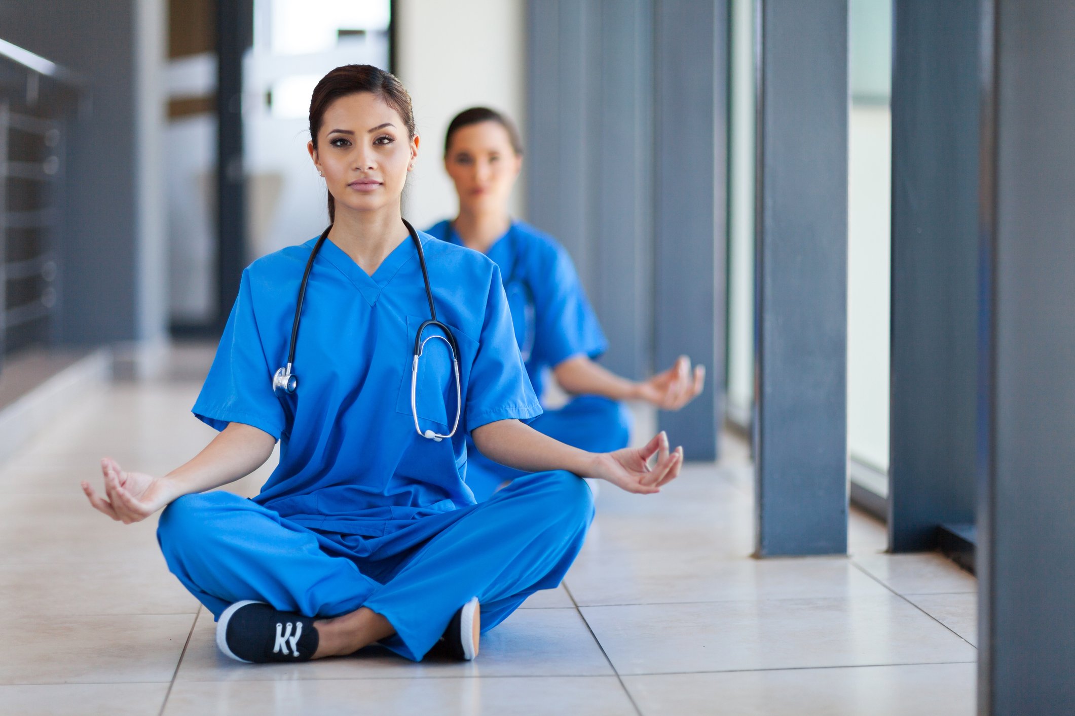 Nurses meditating on the floor Nurses meditating on the floor